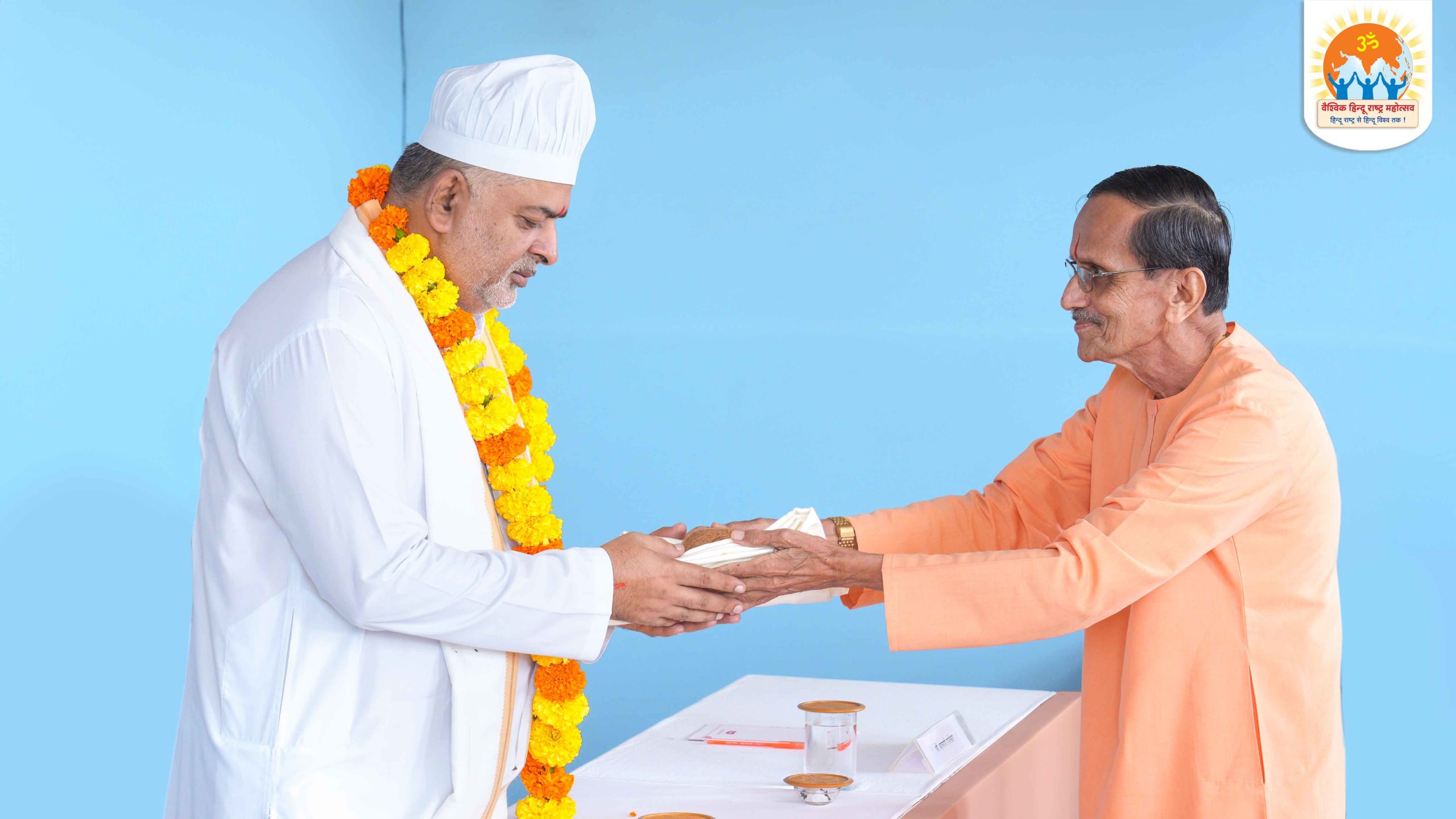 H.H. (Dr) Santoshdevaji Maharaj (Founder, Shivdhara Mission Foundation, Amravati, Maharashtra.) being felicitated by H.H. Ashok Patrikar (Dharmapracharak Saint, Sanatan Sanstha, Maharashtra.)