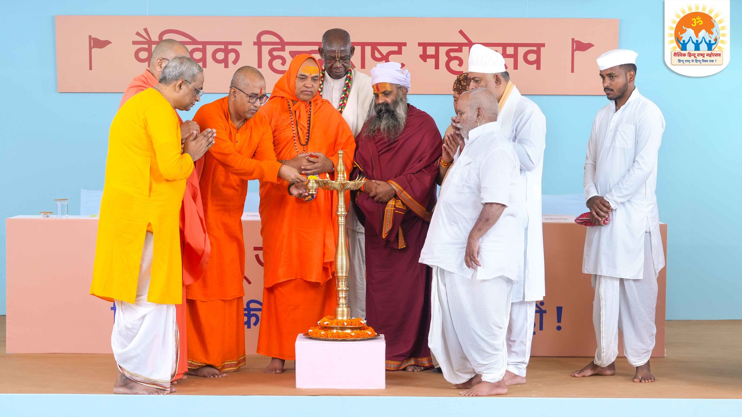 Saints lighting the ceremonious lamp to commence the 12th edition of the ‘Vaishvik Hindu Rashtra Mahotsav