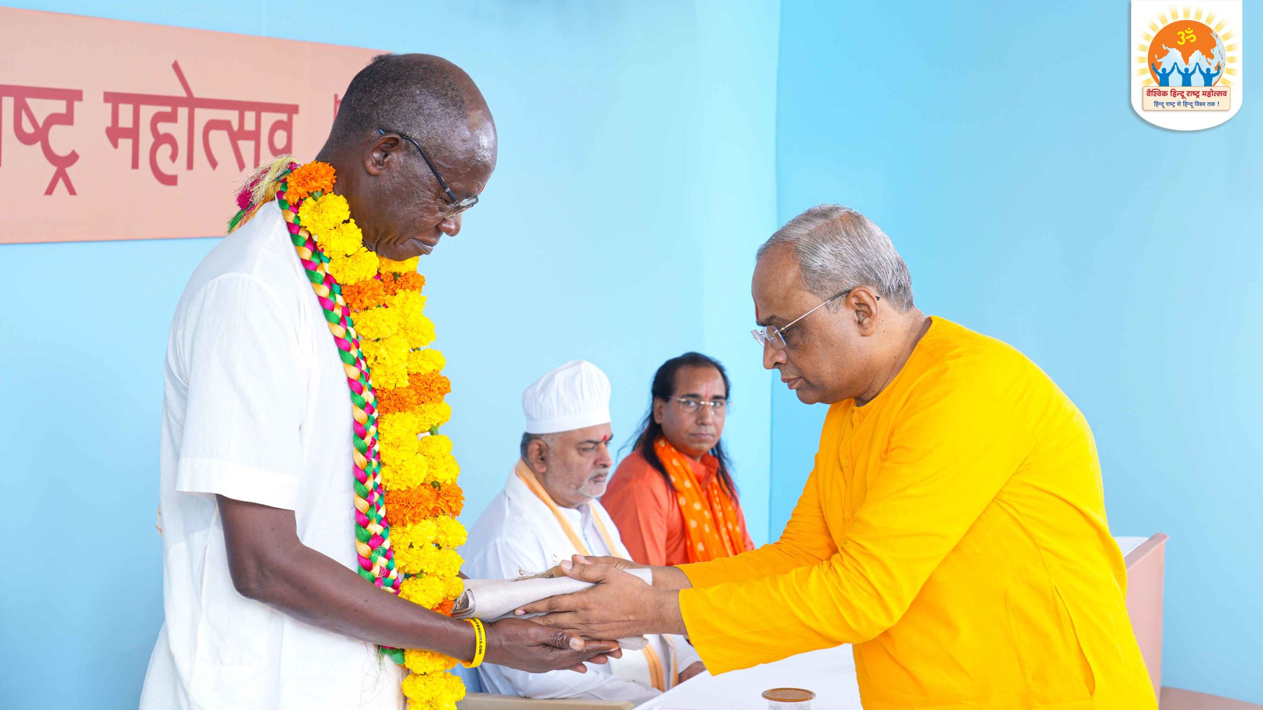 H.H. Srivas Das Vanacari (ISKCON, Ghana, West Africa.) being felicitated by Sadguru (Dr) Charudatta Pingale (National Guide, Hindu Janajagruti Samiti)