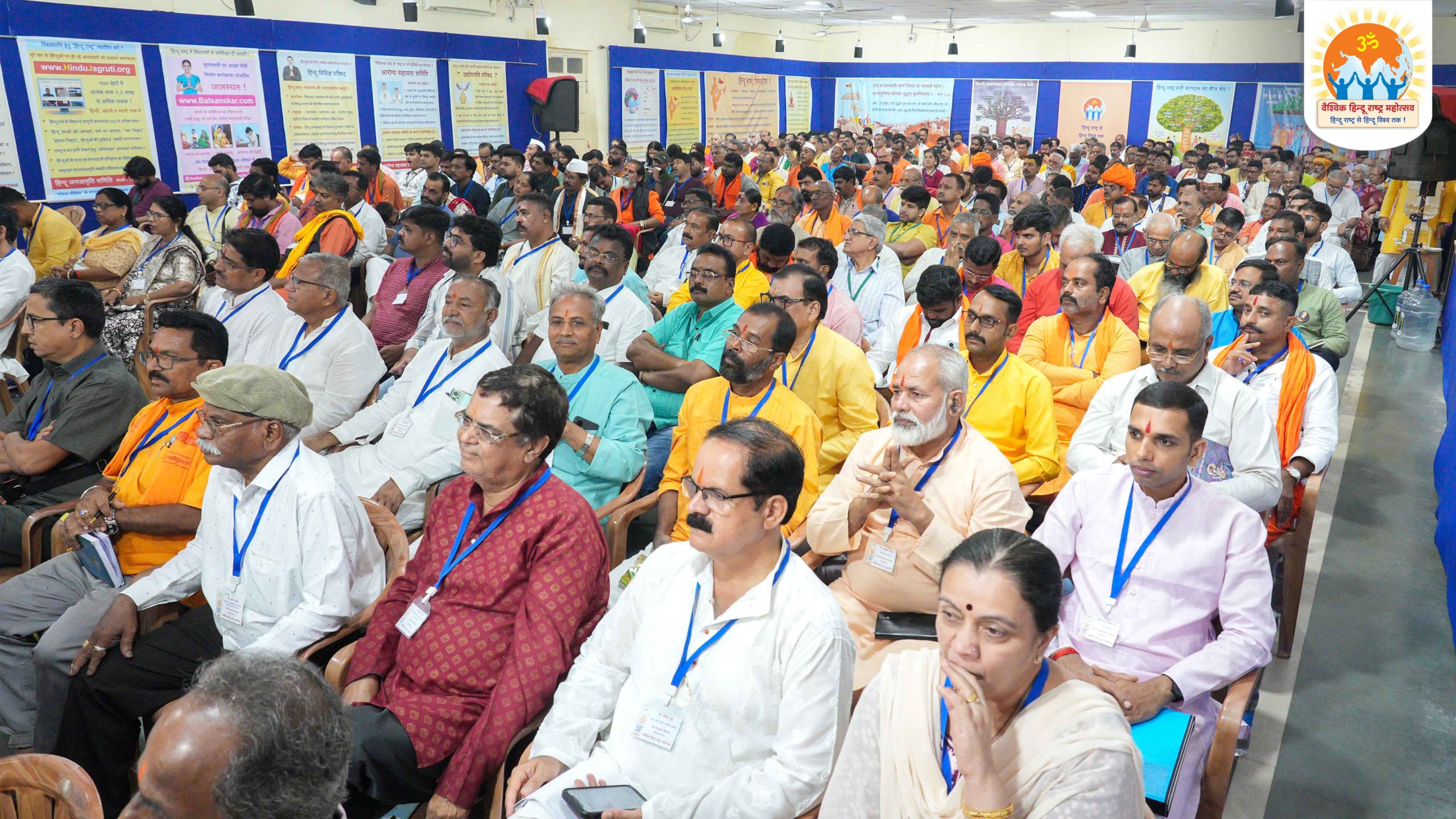 Devout Hindus intently listening to the thoughtful and inspirational speeches by the honourable dignitaries