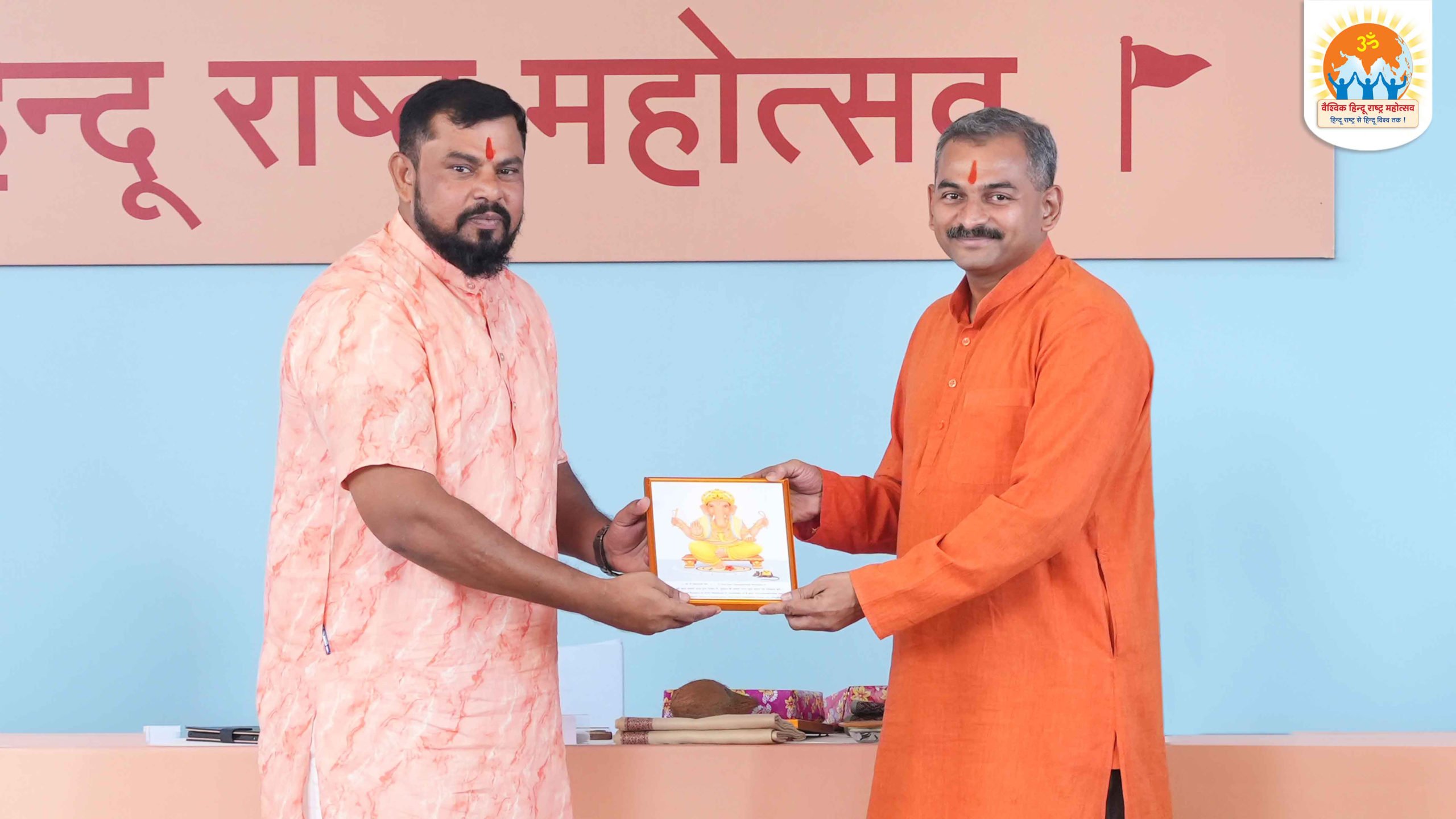 Shri. Vikram Bhave (right) being felicitated by MLA T. Raja Singh Lodh